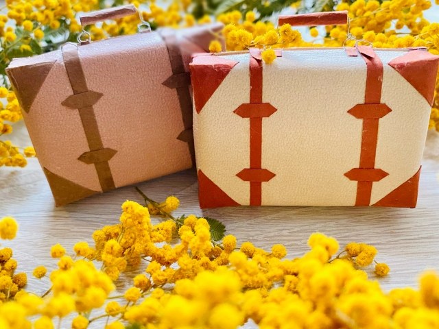 A small keepsake case among mimosa flowers